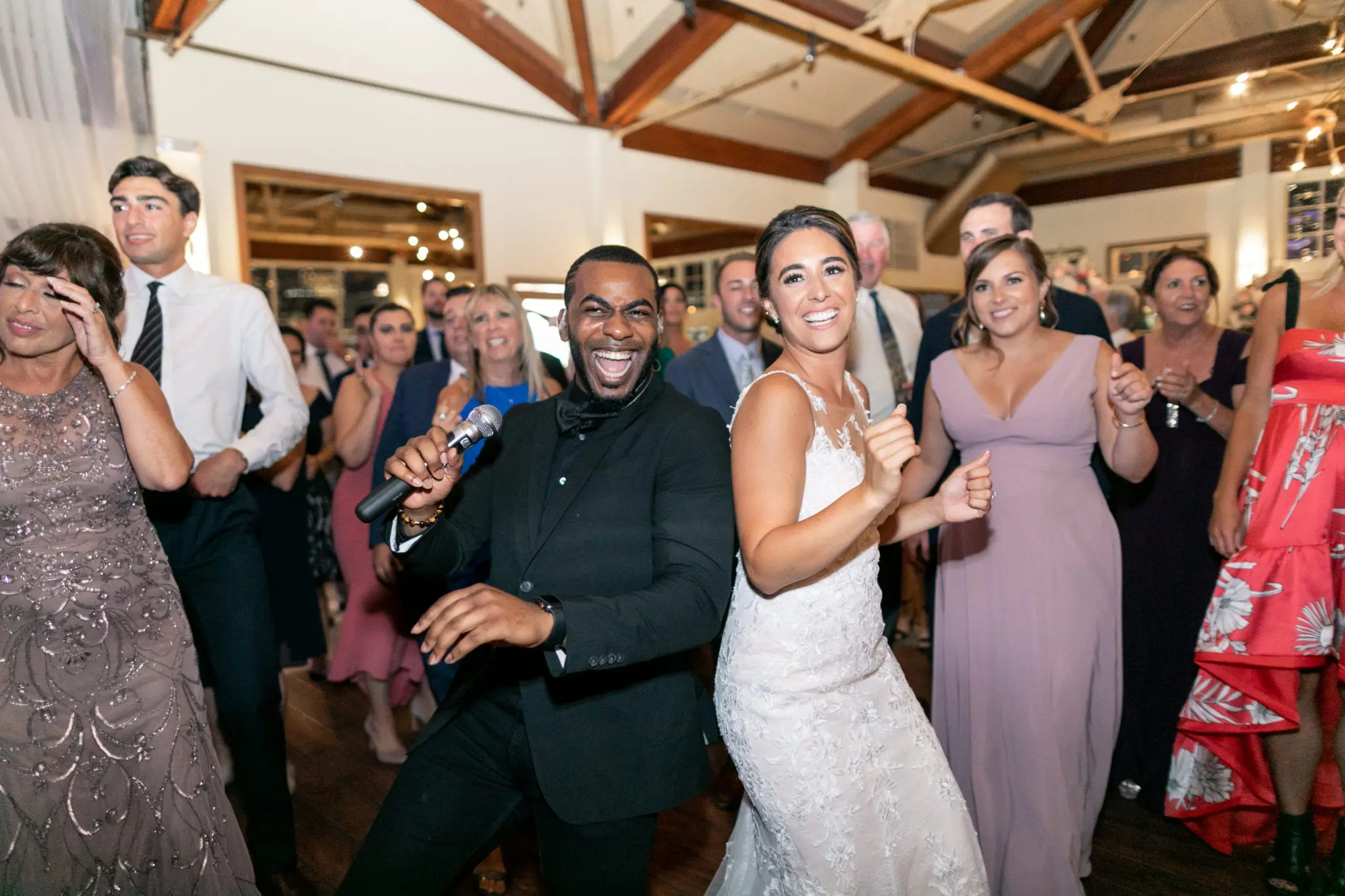 A bunch of people dancing and laughing.