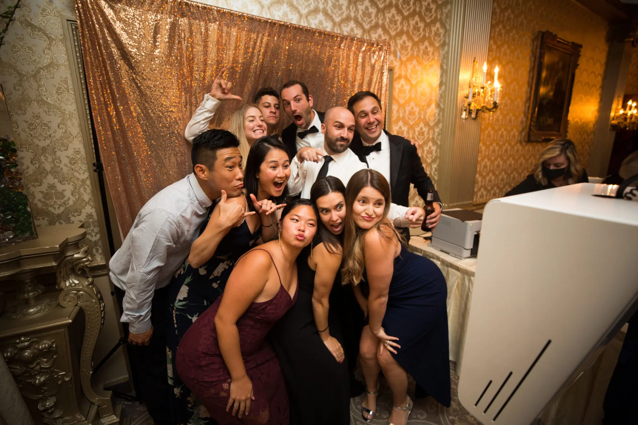 People in a photo booth smiling | Elegant Music Group