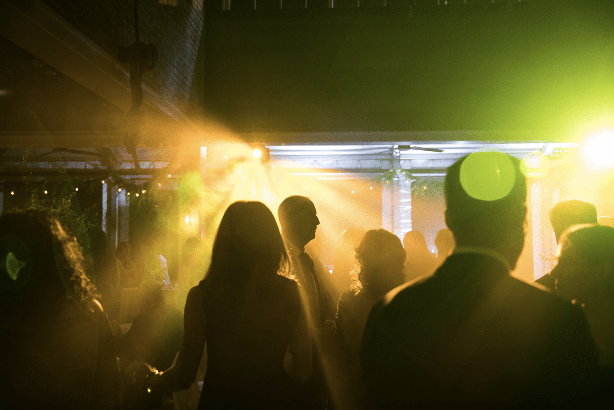 An indoor party room with people.