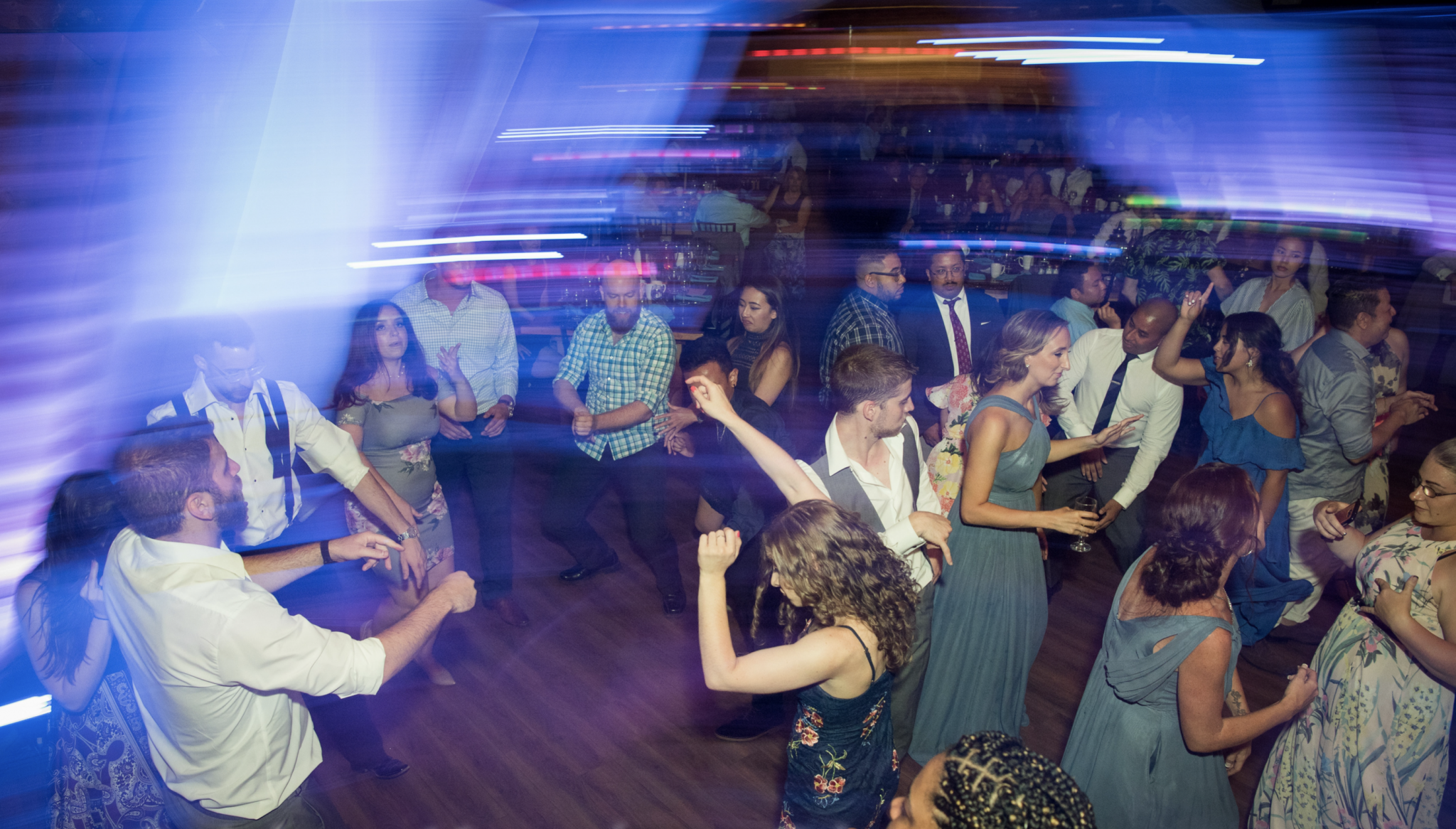 Dancers in a room with blue lights.